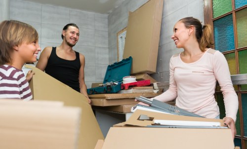 Recycling-focused removal team sorting packing materials in Knightsbridge