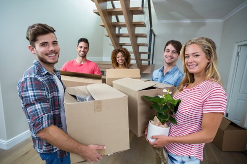 Removal team preparing a safe property move with equipment and protective materials