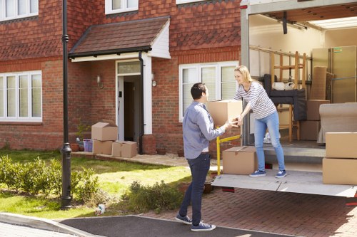 Removal team handling boxes during a Knightsbridge home move