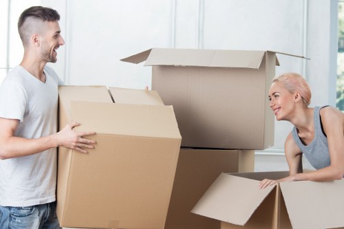 Staff using correct manual handling techniques during a removals task