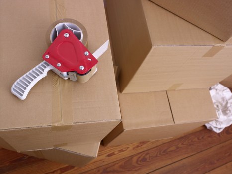 Professional movers preparing furniture for relocation in Knightsbridge
